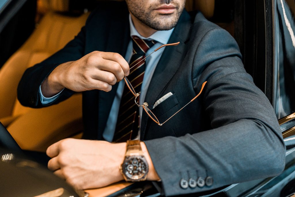 partial-view-of-businessman-with-luxury-watch-hold