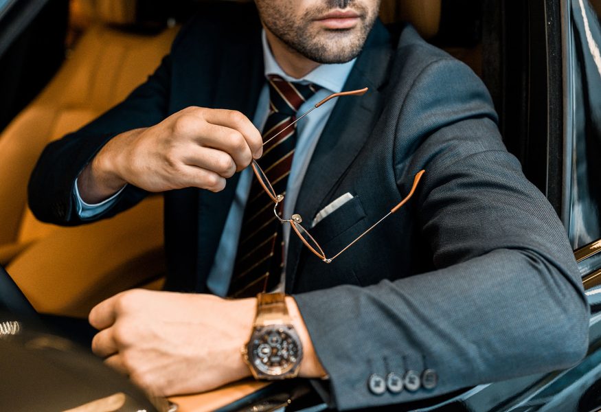 partial-view-of-businessman-with-luxury-watch-hold